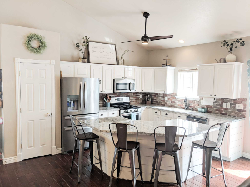 Kitchen with wreath above the pantry.