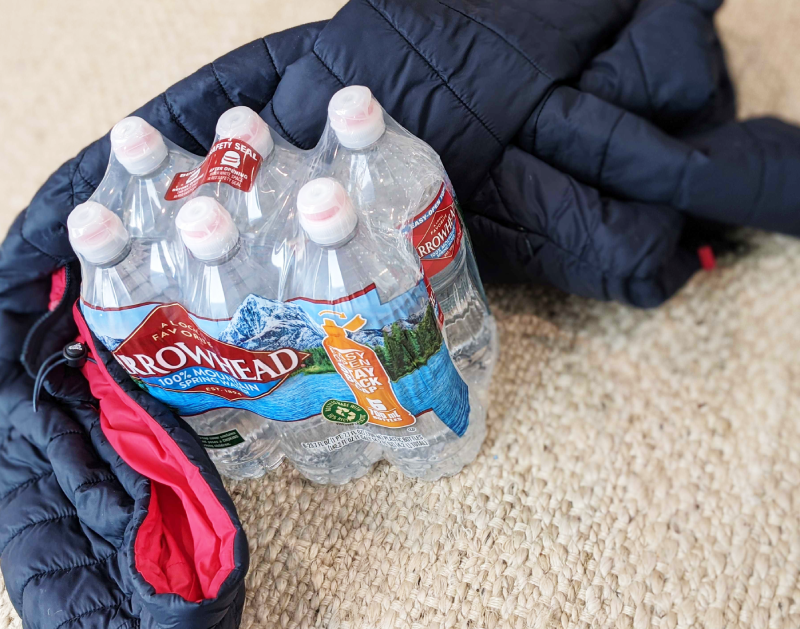 bottled water and a coat