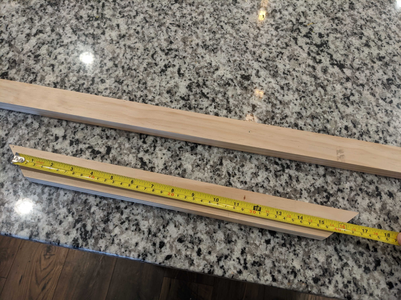 Wood trim with measuring tape on it.