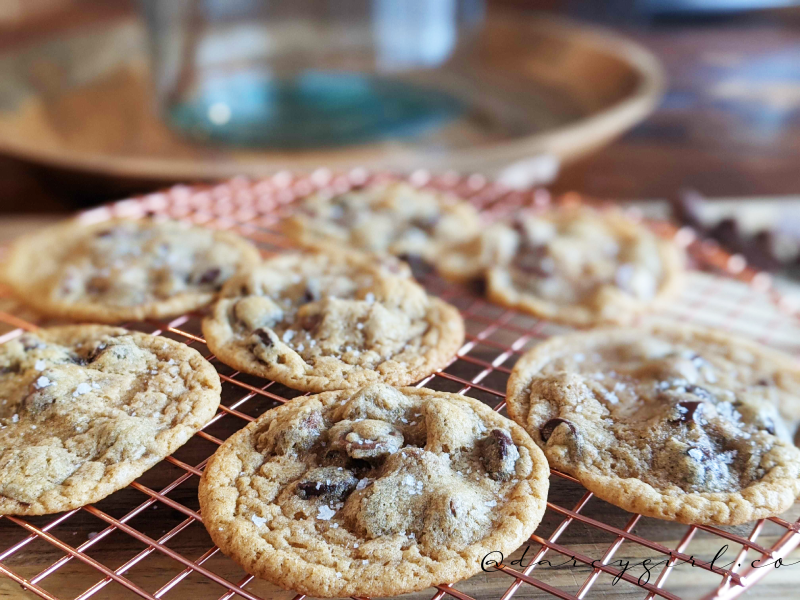 chocolate chip cookies on a wire cooling rack. 