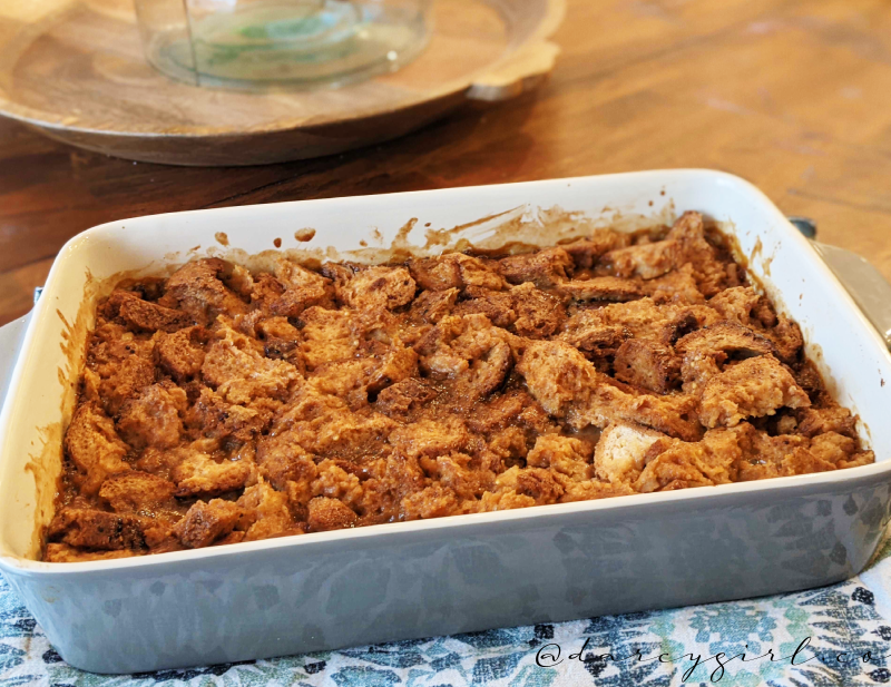 Bread pudding sitting on a table.  