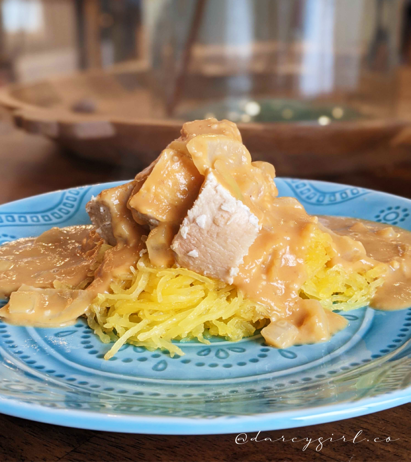 Dairy-free pumpkin alfredo sauce over spaghetti squash noodles and smoked chicken on top. 